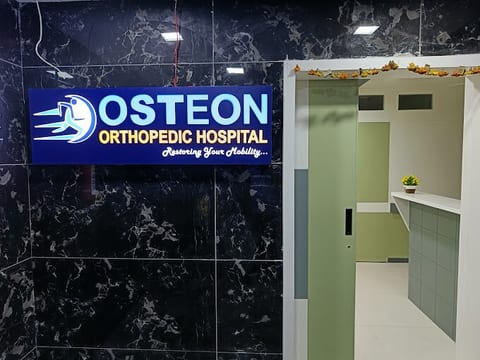Illuminated Osteon Orthopedic Hospital entrance signboard at Pimple Saudagar, Pune