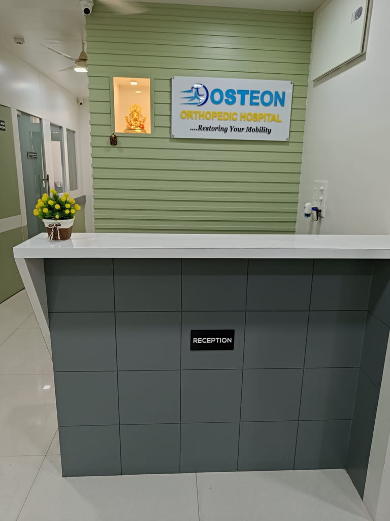 Reception desk at Osteon Orthopedic Hospital with branded signboard, Pimple Saudagar, Pune