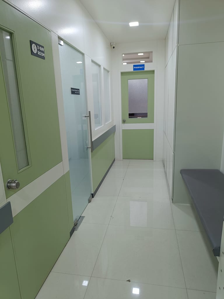 Corridor leading to digital X-ray room and pharmacy at Osteon Orthopedic Hospital, Pimple Saudagar