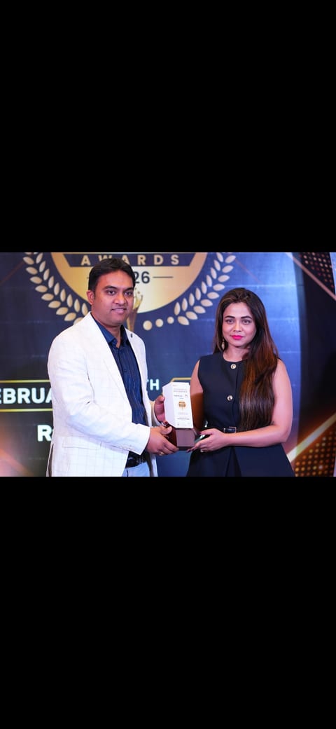 Dr. Harshal V Kalambe Patil receiving award trophy at orthopedic excellence ceremony — Osteon Orthopedic Hospital recognition