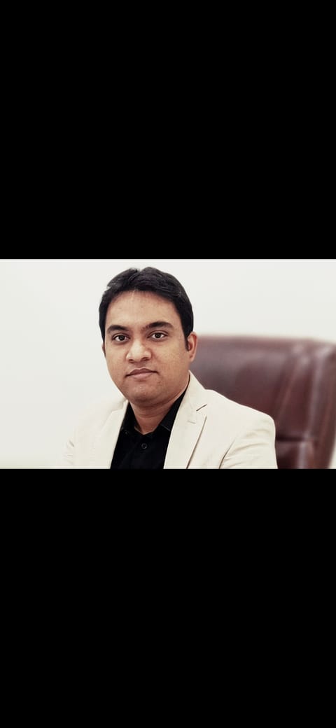 Dr. Harshal V Kalambe Patil, orthopedic surgeon at Osteon Orthopedic Hospital, Pimple Saudagar, Pune — portrait in beige blazer
